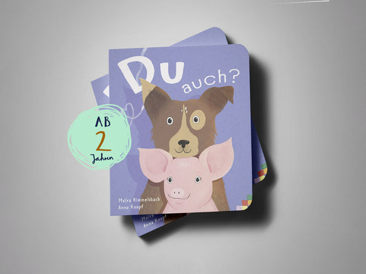 Buchcover „Du auch?“: Illustration eines Hundes und eines Schweins, die den Betrachter freundlich anschauen. Stabiles Pappbuch für Kinder ab 2 Jahren.